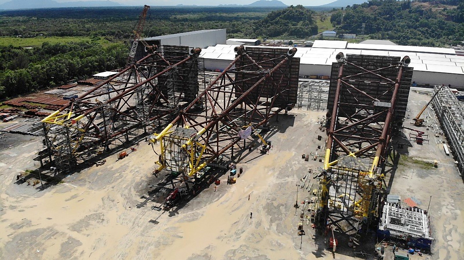 Three wellhead platform jackets in the fabrication yard for the FaS MLNG project